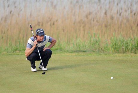 Brett Rumford of Australia lines his putt on the 17th hole during the Volvo China Open in Tianjin municipality, May 5, 2013. REUTERS/China D Brett Rumford of Australia lines his putt on the 17th hole during the Volvo China Open in Tianjin municipality, May 5, 2013. REUTERS/China D