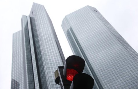 The headquarters of Germany's largest business bank, Deutsche Bank are seen behind a red traffic light in Frankfurt January 30, 2013. REUTER The headquarters of Germany's largest business bank, Deutsche Bank are seen behind a red traffic light in Frankfurt January 30, 2013. REUTER
