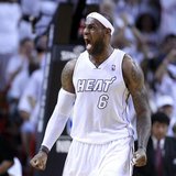 Miami Heat forward LeBron James reacts after dunking the ball in the fourth quarter as the Heat defeated the Milwaukee Bucks in their NBA fi