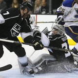 Los Angeles Kings' goaltender Jonathan Quick (R) makes a save as the Kings Rob Scuderi defends against the St. Louis Blues during Game 3 of Los Angeles Kings' goaltender Jonathan Quick (R) makes a save as the Kings Rob Scuderi defends against the St. Louis Blues during Game 3 of
