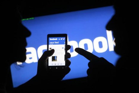 A smartphone user shows the Facebook application on his phone in the central Bosnian town of Zenica, in this photo illustration, May 2, 2013 A smartphone user shows the Facebook application on his phone in the central Bosnian town of Zenica, in this photo illustration, May 2, 2013