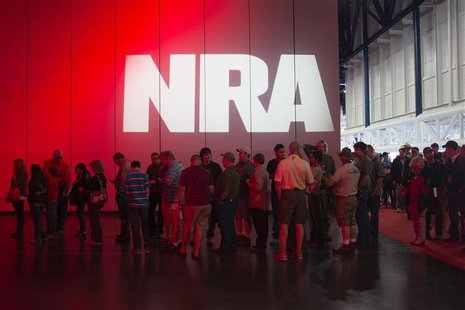 Attendees line-up to meet musician Ted Nugent (not pictured) at a book signing event during the National Rifle Association's annual meeting Attendees line-up to meet musician Ted Nugent (not pictured) at a book signing event during the National Rifle Association's annual meeting