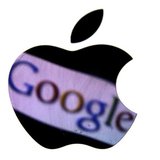 A Google trademark is reflected in Apple logo in this photo illustration taken in Berlin, August 31, 2012. REUTERS/Pawel Kopczynski