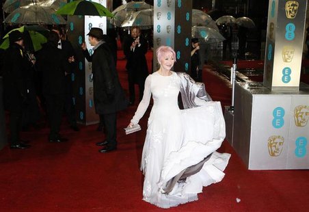 Helen Mirren poses as she arrives for the British Academy of Film and Arts (BAFTA) awards ceremony at the Royal Opera House in London Februa Helen Mirren poses as she arrives for the British Academy of Film and Arts (BAFTA) awards ceremony at the Royal Opera House in London Februa