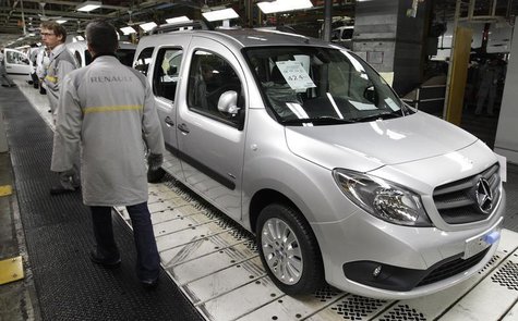 French carmaker Renault employees stand next to a Mercedes Benz Citan based on a Renault Kangoo van at the Renault factory in Maubeuge, nort French carmaker Renault employees stand next to a Mercedes Benz Citan based on a Renault Kangoo van at the Renault factory in Maubeuge, nort