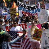 Demonstrators carry signs during an immigration rally on May Day in the Mission District in San Francisco, California May 1, 2013. REUTERS/R