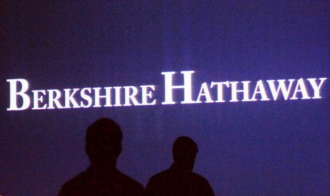 Berkshire Hathaway shareholders walk by a video screen at the company's annual meeting in Omaha May 4, 2013. REUTERS/Rick Wilking Berkshire Hathaway shareholders walk by a video screen at the company's annual meeting in Omaha May 4, 2013. REUTERS/Rick Wilking