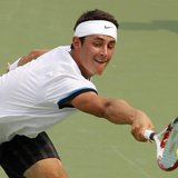 Bernard Tomic of Australia hits a return shot to Roger Federer of Switzerland during their third round match in the 2012 Cincinnati Open ten
