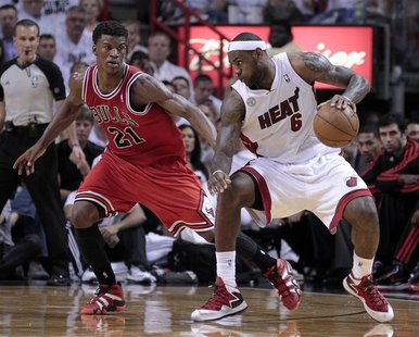 Miami Heat small forward LeBron James (6) is guarded by Chicago Bulls small forward Jimmy Butler (21) in the second half during Game 1 of th Miami Heat small forward LeBron James (6) is guarded by Chicago Bulls small forward Jimmy Butler (21) in the second half during Game 1 of th