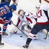 Washington Capitals goalie Braden Holtby (70) stops a shot by New York Rangers right wing Derek Dorsett (15) in the third period of Game 3 o