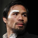 Manny Pacquiao of the Philippines attends a post-fight news conference following his majority decision victory over Juan Manuel Marquez of M