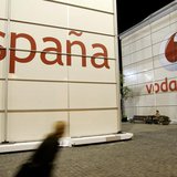 A visitor walks in front of the Vodafone stand during the 3GSM World Congress at the Feria of Barcelona, in central Barcelona February 12, 2 A visitor walks in front of the Vodafone stand during the 3GSM World Congress at the Feria of Barcelona, in central Barcelona February 12, 2