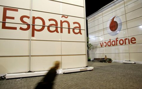 A visitor walks in front of the Vodafone stand during the 3GSM World Congress at the Feria of Barcelona, in central Barcelona February 12, 2 A visitor walks in front of the Vodafone stand during the 3GSM World Congress at the Feria of Barcelona, in central Barcelona February 12, 2