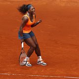 Serena Williams of the U.S. celebrates her victory against Lourdes Dominguez Lino of Spain during their women's singles match at the Madrid 