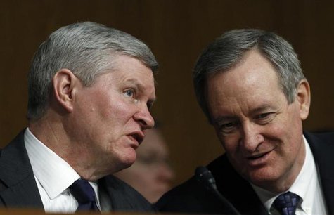 Senate Banking, Housing and Urban Affairs Committee Chairman Tim Johnson (L) (D-SD) talks with Senator Mike Crapo (R-ID) during Federal Rese Senate Banking, Housing and Urban Affairs Committee Chairman Tim Johnson (L) (D-SD) talks with Senator Mike Crapo (R-ID) during Federal Rese