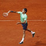 Roger Federer of Switzerland returns the ball to Radek Stepanek of the Czech Republic during their men's singles match at the Madrid Open te Roger Federer of Switzerland returns the ball to Radek Stepanek of the Czech Republic during their men's singles match at the Madrid Open te
