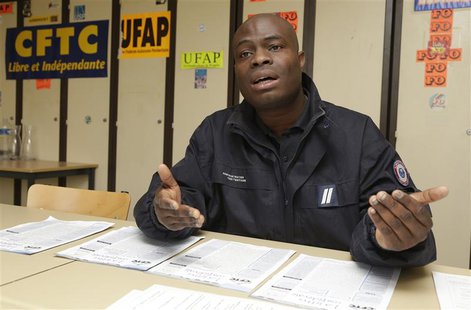 Villepinte prison guard Blaise Gangbazo speaks at a desk inside a labour union meeting room during an interview with Reuters in Villepinte, Villepinte prison guard Blaise Gangbazo speaks at a desk inside a labour union meeting room during an interview with Reuters in Villepinte,