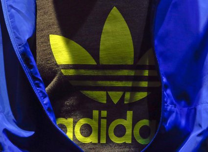 The Adidas logo is pictured on a shirt during the company's annual news conference in Herzogenaurach March 7, 2013. REUTERS/Michael Dalder The Adidas logo is pictured on a shirt during the company's annual news conference in Herzogenaurach March 7, 2013. REUTERS/Michael Dalder
