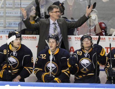Buffalo Sabres interim head coach Ron Rolston (top) reacts to a penalty during the second period of their NHL hockey game against the Montre Buffalo Sabres interim head coach Ron Rolston (top) reacts to a penalty during the second period of their NHL hockey game against the Montre