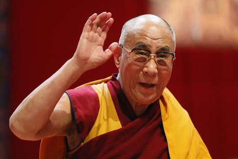 Tibet's exiled spiritual leader the Dalai Lama waves to the audience after his first speech during the European Tibetan Buddhist Conference Tibet's exiled spiritual leader the Dalai Lama waves to the audience after his first speech during the European Tibetan Buddhist Conference