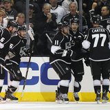 Los Angeles Kings Anze Kopitar (3rd R) celebrates with Dustin Brown (2nd R) and Jeff Carter after scoring against the St. Louis Blues during