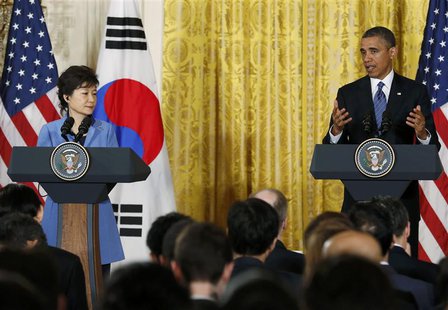 U.S. President Barack Obama (R) gestures as he and South Korea's President Park Geun-hye address a joint news conference in the East Room of U.S. President Barack Obama (R) gestures as he and South Korea's President Park Geun-hye address a joint news conference in the East Room of