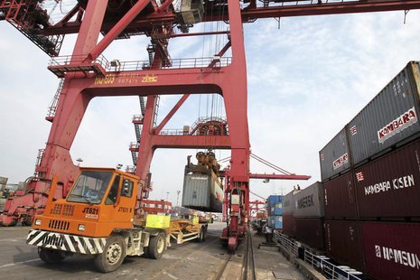 A truck is loaded with a shipping container at a port in Nantong, Jiangsu province May 5, 2013. REUTERS/China Daily A truck is loaded with a shipping container at a port in Nantong, Jiangsu province May 5, 2013. REUTERS/China Daily