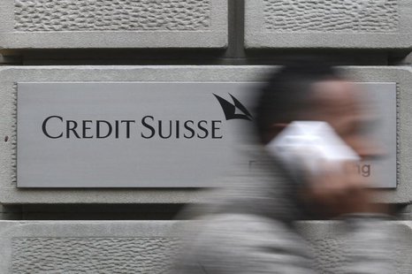 A man uses his cell phone as he walks past a branch of Swiss bank Credit Suisse in Zurich, January 31, 2012. REUTERS/Christian Hartmann A man uses his cell phone as he walks past a branch of Swiss bank Credit Suisse in Zurich, January 31, 2012. REUTERS/Christian Hartmann