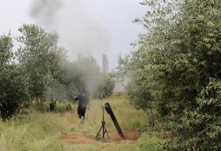 A Free Syrian Army fighter is seen near a mortar in Khirbet Ghazaleh, Daraa, May 3, 2013. Picture taken May 3, 2013. REUTERS/Thaer Abdallah A Free Syrian Army fighter is seen near a mortar in Khirbet Ghazaleh, Daraa, May 3, 2013. Picture taken May 3, 2013. REUTERS/Thaer Abdallah