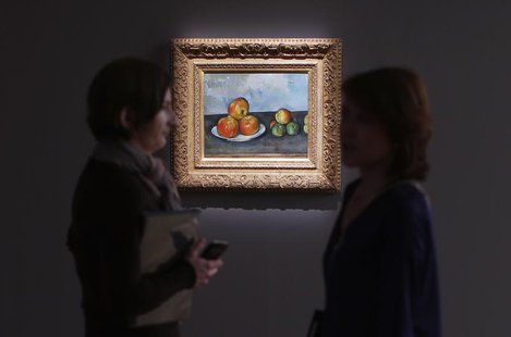 Visitors talk near Paul Cezanne's 'Les Pommes,' estimated between $25-35 million, during a preview of Sotheby's May 7 Impressionist and Mode Visitors talk near Paul Cezanne's 'Les Pommes,' estimated between $25-35 million, during a preview of Sotheby's May 7 Impressionist and Mode