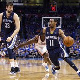 Memphis Grizzlies guard Mike Conley (R) drives against the Oklahoma City Thunder in the second half of their Game 1 NBA Western Conference s