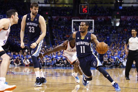 Memphis Grizzlies guard Mike Conley (R) drives against the Oklahoma City Thunder in the second half of their Game 1 NBA Western Conference s Memphis Grizzlies guard Mike Conley (R) drives against the Oklahoma City Thunder in the second half of their Game 1 NBA Western Conference s