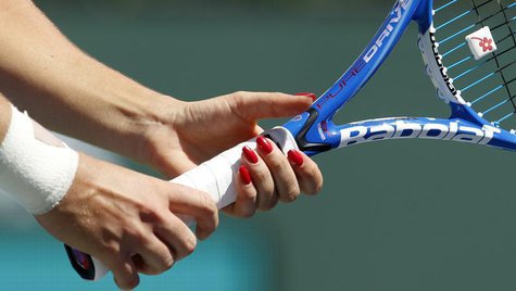 Agnieszka Radwanska of Poland grips her racquet as she receives serve from Elena Dementieva of Russia during their match at the Indian Wells Agnieszka Radwanska of Poland grips her racquet as she receives serve from Elena Dementieva of Russia during their match at the Indian Wells