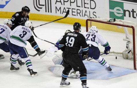 San Jose Sharks' Patrick Marleau (L, in black) scores the winning goal in overtime over the Vancouver Canucks during Game 4 of their NHL Wes San Jose Sharks' Patrick Marleau (L, in black) scores the winning goal in overtime over the Vancouver Canucks during Game 4 of their NHL Wes