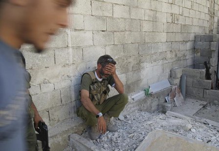 A Free Syrian Army commander reacts after they failed to capture a Syrian Amry tank during clashes with forces loyal to Syria's President Ba A Free Syrian Army commander reacts after they failed to capture a Syrian Amry tank during clashes with forces loyal to Syria's President Ba