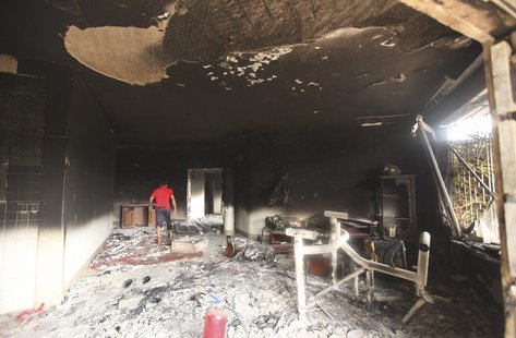 A man walks inside the U.S. consulate, which was attacked and set on fire by gunmen yesterday, in Benghazi September 12, 2012. REUTERS/Esam A man walks inside the U.S. consulate, which was attacked and set on fire by gunmen yesterday, in Benghazi September 12, 2012. REUTERS/Esam