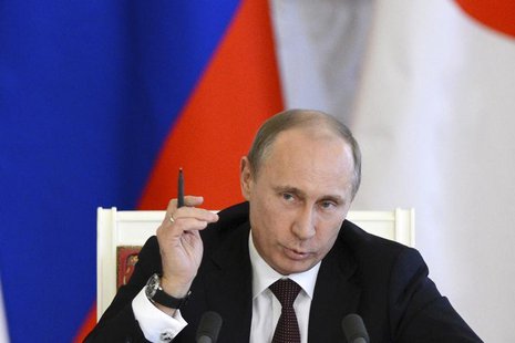 Russia's President Vladimir Putin attends a news conference after talks with Japan's Prime Minister Shinzo Abe at the Kremlin in Moscow Apri Russia's President Vladimir Putin attends a news conference after talks with Japan's Prime Minister Shinzo Abe at the Kremlin in Moscow Apri