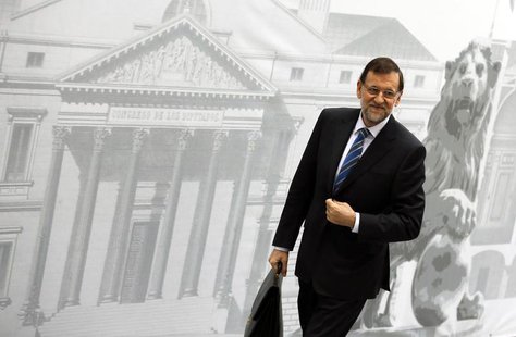 Spain's Prime Minister Mariano Rajoy smiles as he arrives at Parliament to present a new reform program during a session in Madrid May 8, 20 Spain's Prime Minister Mariano Rajoy smiles as he arrives at Parliament to present a new reform program during a session in Madrid May 8, 20