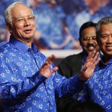 Malaysia's Prime Minister Najib Razak (L) and his deputy Muhyiddin Yassin share a light moment after winning the elections at his party head Malaysia's Prime Minister Najib Razak (L) and his deputy Muhyiddin Yassin share a light moment after winning the elections at his party head