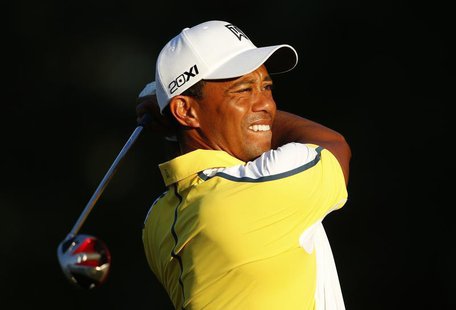 Tiger Woods of the U.S. watches his tee shot on the 10th hole during a practice round before The Players Championship PGA golf tournament at Tiger Woods of the U.S. watches his tee shot on the 10th hole during a practice round before The Players Championship PGA golf tournament at