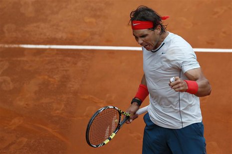 Rafael Nadal of Spain celebrates his victory over Benoit Paire of France at the end of their men's singles match at the Madrid Open tennis t Rafael Nadal of Spain celebrates his victory over Benoit Paire of France at the end of their men's singles match at the Madrid Open tennis t
