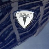 A logo of Tesla Motors on an electric car model is seen outside a showroom in New York June 28, 2010. REUTERS/Shannon Stapleton A logo of Tesla Motors on an electric car model is seen outside a showroom in New York June 28, 2010. REUTERS/Shannon Stapleton