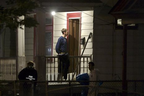 FBI agents search the home where three Cleveland women were found alive after vanishing in Cleveland, Ohio, May 7, 2013. REUTERS/John Gress FBI agents search the home where three Cleveland women were found alive after vanishing in Cleveland, Ohio, May 7, 2013. REUTERS/John Gress