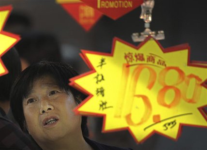 A customer looks at price tags at a supermarket in Hefei, Anhui province, May 9, 2013. REUTERS/Stringer A customer looks at price tags at a supermarket in Hefei, Anhui province, May 9, 2013. REUTERS/Stringer