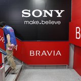 A woman walks past signs of Sony Corp's Bravia LCD TV at an electronics store in Tokyo April 18, 2012. REUTERS/Toru Hanai A woman walks past signs of Sony Corp's Bravia LCD TV at an electronics store in Tokyo April 18, 2012. REUTERS/Toru Hanai