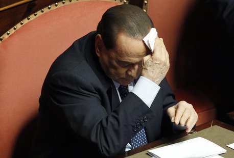 People of Freedom (PDL) party member and former Prime Minister Silvio Berlusconi wipes his forehead as he attends the Upper house of the par People of Freedom (PDL) party member and former Prime Minister Silvio Berlusconi wipes his forehead as he attends the Upper house of the par