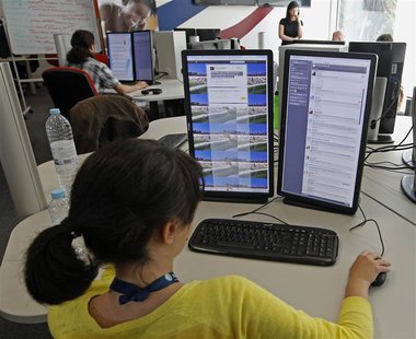 People work at a call center in Lisbon on the outskirts of Lisbon April 22, 2013. REUTERS/Jose Manuel Ribeiro People work at a call center in Lisbon on the outskirts of Lisbon April 22, 2013. REUTERS/Jose Manuel Ribeiro