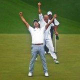 Adam Scott of Australia (L) celebrates winning the Masters with caddie Steve Williams (C) in front of Angel Cabrera of Argentina (R) on the 
