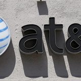 An At&T logo is seen atop a store in Beverly Hills, California August 31, 2011. REUTERS/Danny Moloshok An At&T logo is seen atop a store in Beverly Hills, California August 31, 2011. REUTERS/Danny Moloshok
