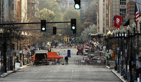 A lone official walks through the scene of the Boston Marathon bombings after much of the finish line area was dismantled overnight on Boyls A lone official walks through the scene of the Boston Marathon bombings after much of the finish line area was dismantled overnight on Boyls